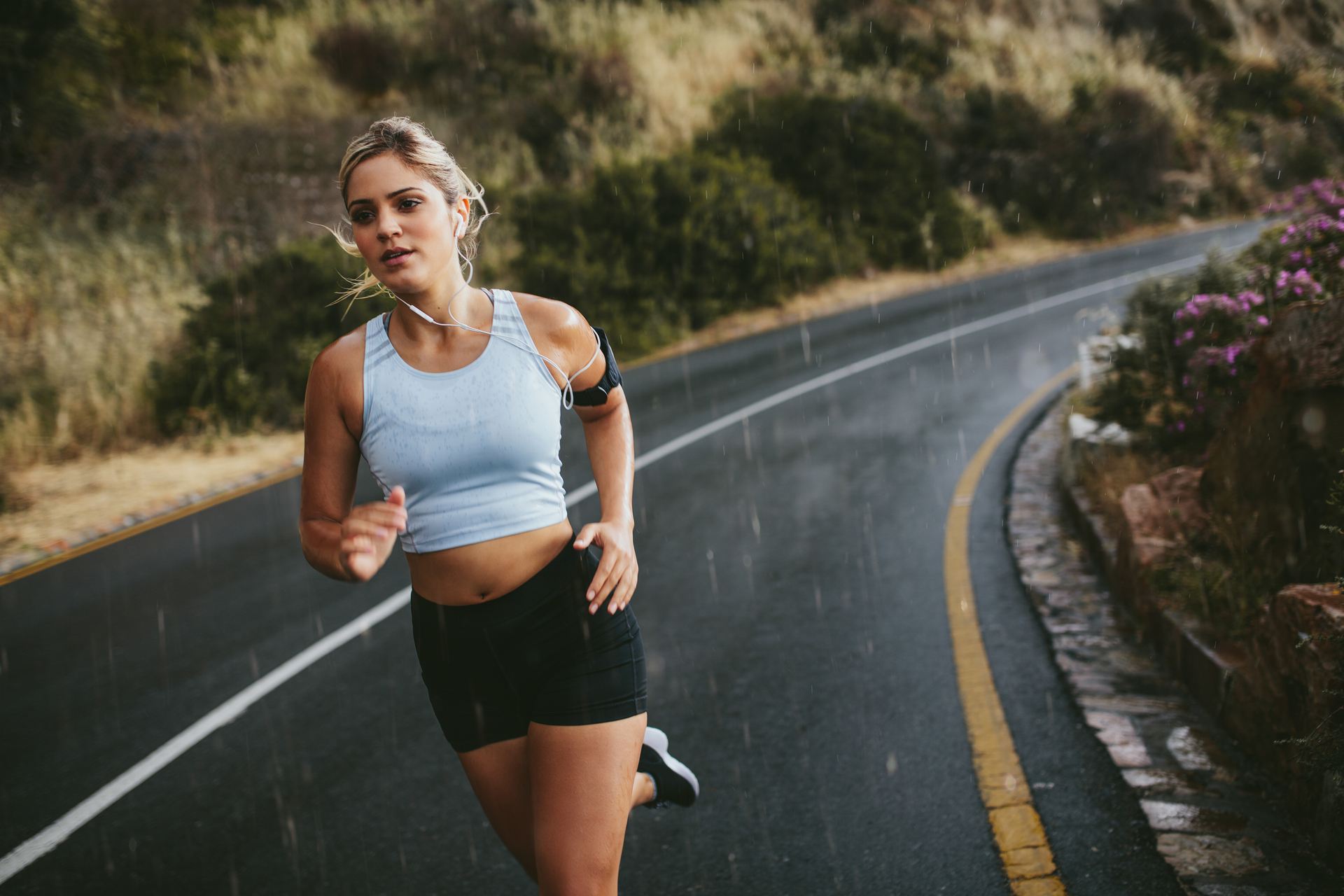 fit-young-woman-running-on-highway-P3EQUN8.jpg