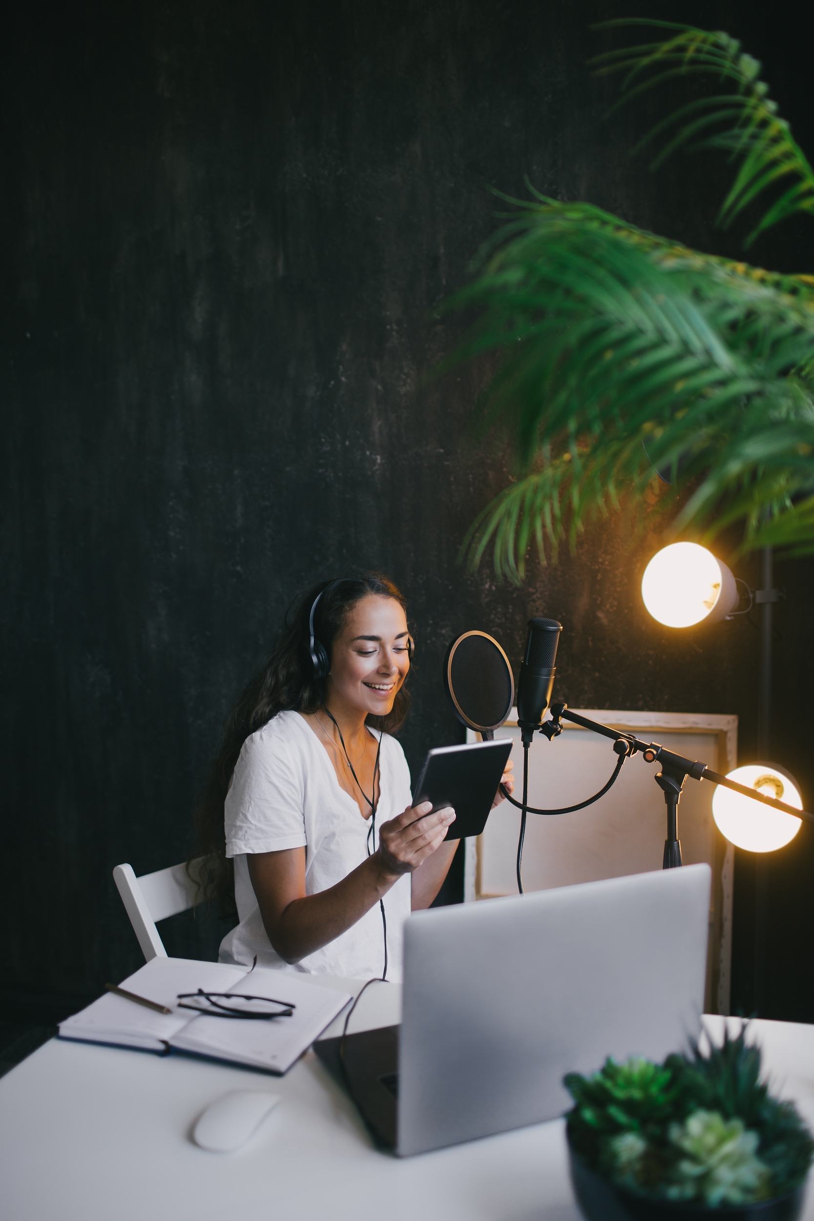 young-woman-blogger-recording-podcast-using-microp-7RY7EAM-1.jpg